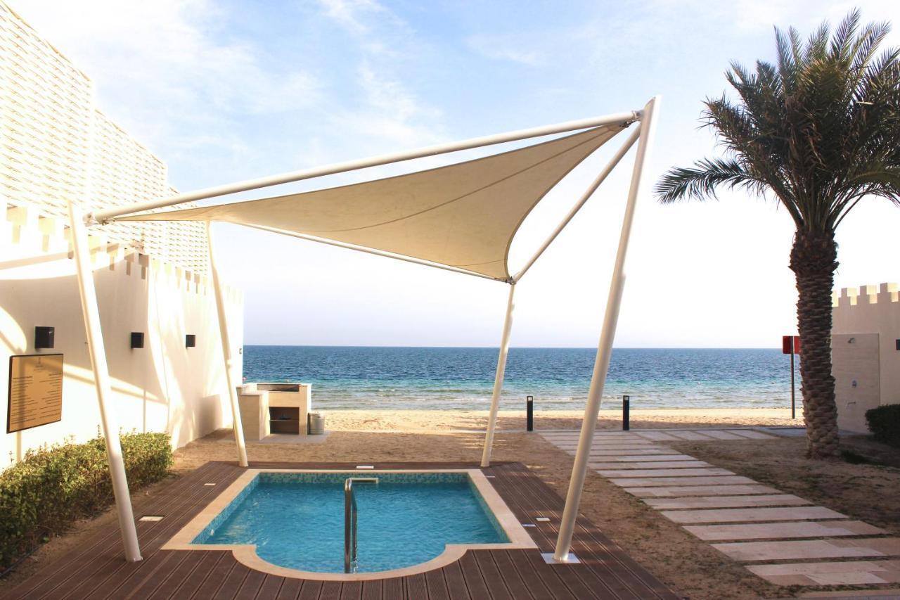 Sealine Beach, A Murwab Resort Mesaieed Luaran gambar A shade sail over a swimming pool